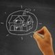 stockvault-hand-drawing-a-house-on-blackboard-real-estate-and-housing-concept178132